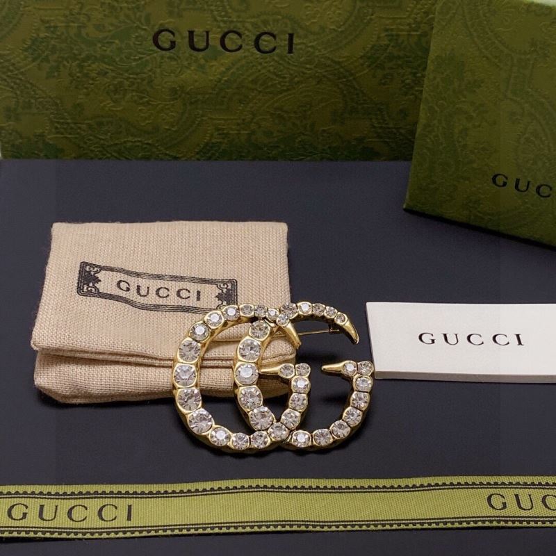 G*u*i brooches